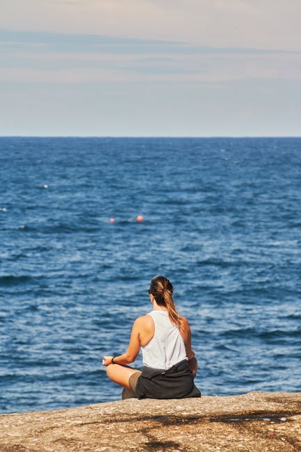 Person sitting in a thoughtful pose meditating